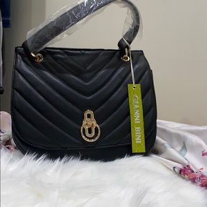 A brand new Gianni Bini cross body bag.
